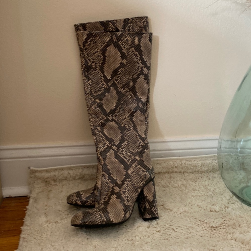Snake print knee high boots